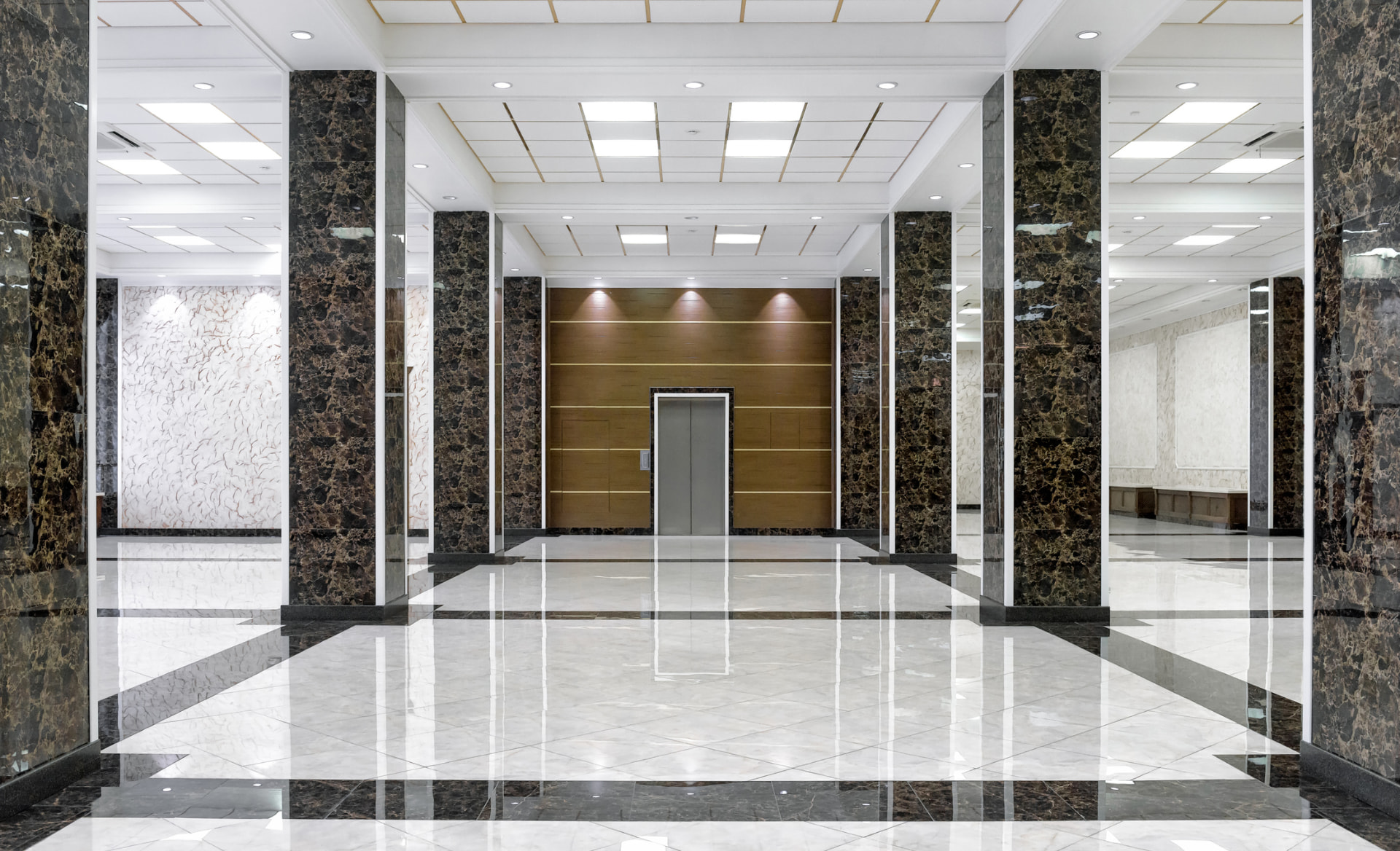 Polished marble lobby floors and glass entry after professional interior cleaning in Alliance, Ohio