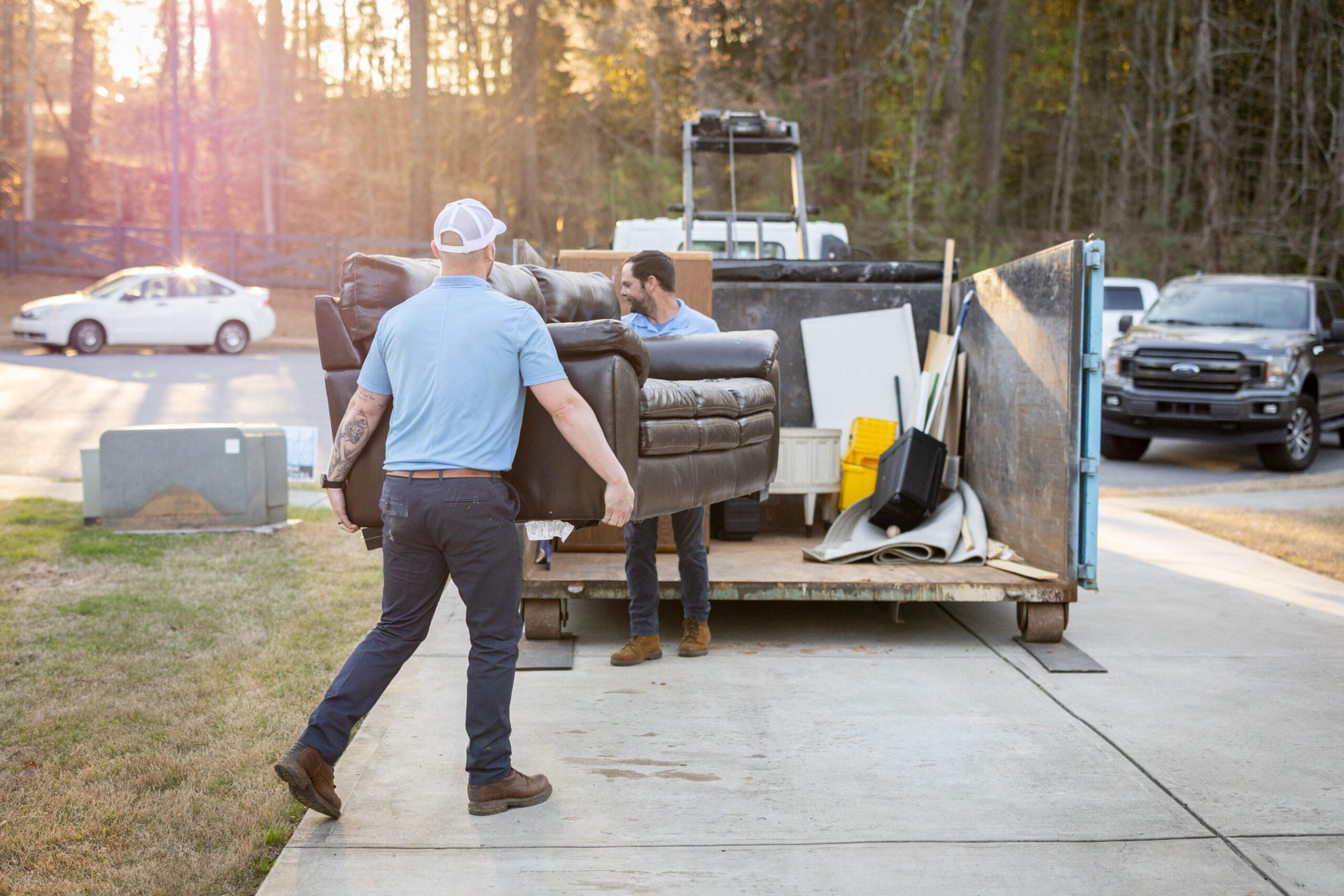 AllClear crew loading a couch into a junk removal trailer in Bainbridge, Ohio