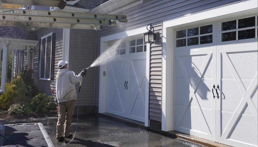 Soft washing vinyl siding and garage doors at a home in Solon, Ohio