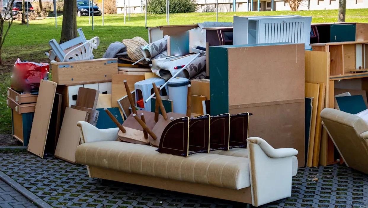 Large pile of old furniture and cabinets staged for junk removal in Chagrin Falls, Ohio